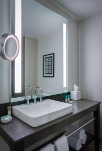 a bathroom with a large sink and a mirror at Hyatt Regency Cleveland at The Arcade in Cleveland