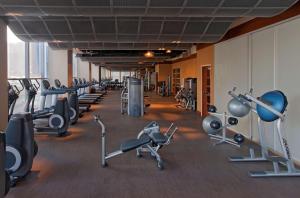 a gym with rows of exercise bikes and machines at Hyatt at Olive 8 in Seattle