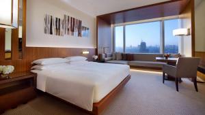 Postel nebo postele na pokoji v ubytování Hyatt Regency Changchun