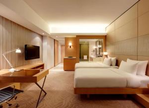 Uma TV ou centro de entretenimento em Hyatt Regency Hong Kong, Sha Tin