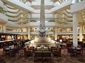 a hotel lobby with a fountain in the middle at Hyatt Regency Perth in Perth