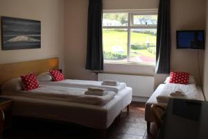 Ліжко або ліжка в номері North Star Hotel Olafsvik