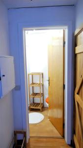 a room with a door and a room with a ladder at EZY Ramos apartment Alfama in Lisbon