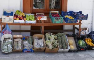a table filled with lots of fruits and vegetables at Tiros Apartments Armonia in Tyros