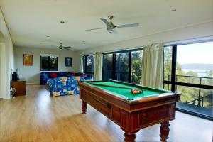 a living room with a pool table at Berringar in Forster