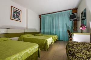 Katil atau katil-katil dalam bilik di Hotel Alle Due Palme
