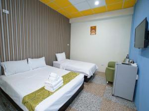 Postel nebo postele na pokoji v ubytování 台東市安慶67套房館歡迎短租長租
