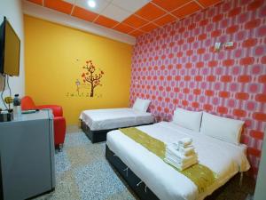 Postel nebo postele na pokoji v ubytování 台東市安慶67套房館歡迎短租長租