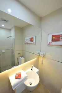 a bathroom with a sink and a toilet and a shower at Tune Hotel - 1Borneo Kota Kinabalu in Kota Kinabalu