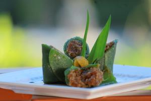 a plate with some food on top at Bali Bening in Munduk