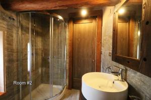a bathroom with a sink and a shower at Lou Subric in Stroppo