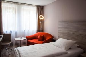 Postel nebo postele na pokoji v ubytování Hotel Kastanienhof