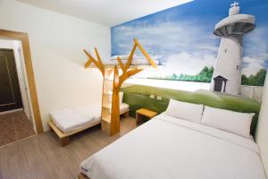 Postel nebo postele na pokoji v ubytování 解憂海灣Chill Bay潛水旅店