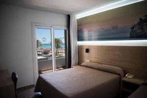 Postel nebo postele na pokoji v ubytování Hotel Arena Prado