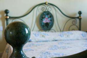 מיטה או מיטות בחדר ב-Il balcone di Rina