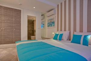 Postel nebo postele na pokoji v ubytování Hotel Aleksandar