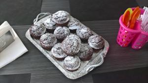 a tray of donuts with powdered sugar on a table at Quiero Más B&B in San Nicola Arcella +35 photos