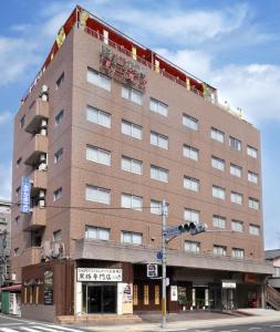 
a large building with a sign on the side of it at Hotel Union in Kagoshima
