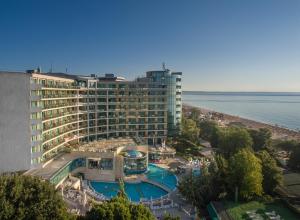 a large hotel with a swimming pool in front of the ocean at Marina Grand Beach Hotel - All Inclusive Plus in Golden Sands