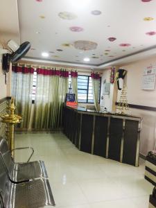 a hair salon with a bar in a room at Mega Tourist Home Palarivattom in Cochin