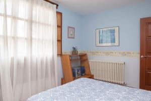 Postel nebo postele na pokoji v ubytování Casa Roble