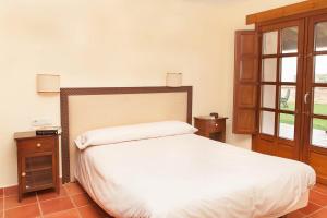 Postel nebo postele na pokoji v ubytování Casa Roble