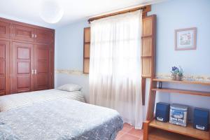 Postel nebo postele na pokoji v ubytování Casa Roble