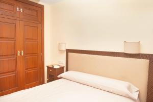 Postel nebo postele na pokoji v ubytování Casa Roble