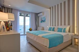 Postel nebo postele na pokoji v ubytování Hotel Aleksandar