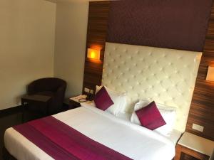 Postel nebo postele na pokoji v ubytování Hotel Ivory 32