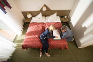 Das FRITZ Hotel tesisinde bir odada yatak veya yataklar