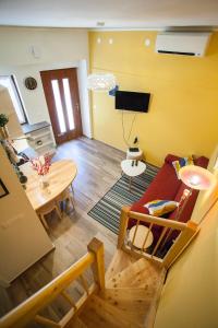 a living room with a couch and a table at Apartment Koper in Koper