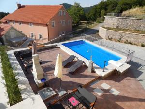 an overhead view of a swimming pool on a house at Apartments Oltari in Sveti Juraj