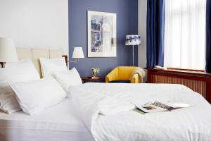 Postel nebo postele na pokoji v ubytování Seaside Park Hotel Leipzig