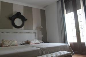 A bed or beds in a room at Hotel Villa Maria