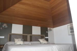 A bed or beds in a room at Hotel Villa Maria