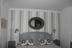A bed or beds in a room at Hotel Villa Maria