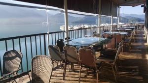 a row of tables and chairs on a balcony at Sun Fog Hotel in Yuchi