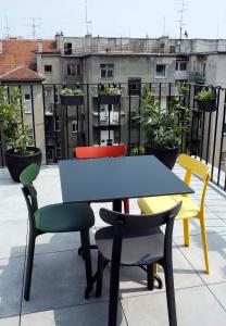 a table and chairs on top of a roof at Studio Apartman Olaf in Zagreb
