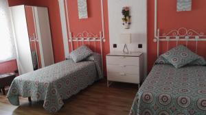 Posteľ alebo postele v izbe v ubytovaní Casa Tiburcio