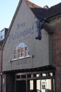 a building with a sign on the side of it at The Wellington in Welwyn