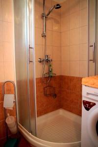 a shower with a glass door in a bathroom at Casa Eufemia in Marasi +39 photos