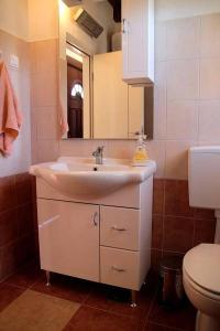 a bathroom with a sink and a toilet at Casa Eufemia in Marasi