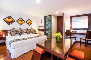 Postel nebo postele na pokoji v ubytování Hotel Platinum Suite + 29 fotografií