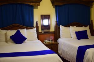 Postel nebo postele na pokoji v ubytování Hotel Tradicional