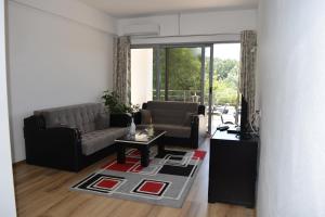 a living room with a couch and a table at Leli Apartments in Ulcinj