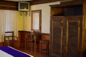 Postel nebo postele na pokoji v ubytování Hotel Tradicional
