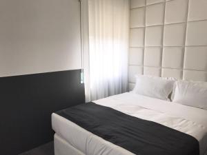 Postel nebo postele na pokoji v ubytování Hotel Pex Padova