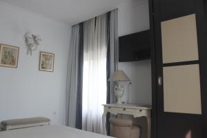 A bed or beds in a room at Hotel Villa Maria