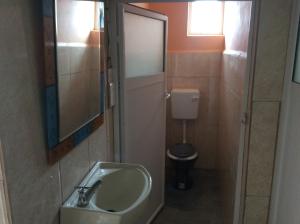 a bathroom with a sink and a toilet at Guesthouse casa lea in La Gaulette +31 photos
